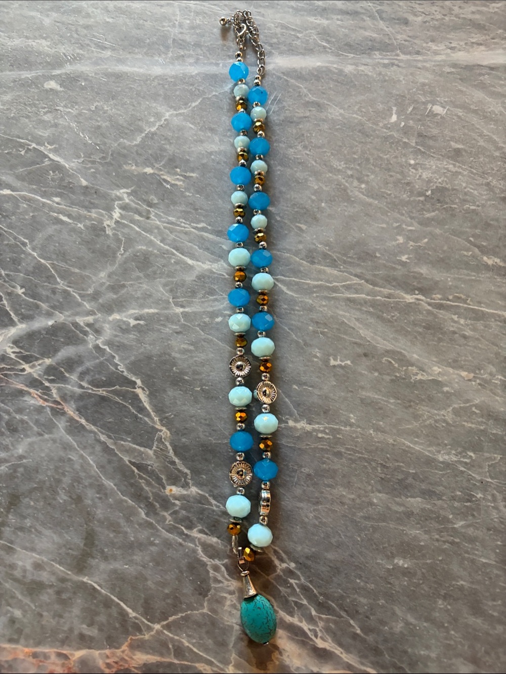 Two blue beaded necklaces